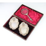 A pair of Edwardian pierced and repousse silver bon bon dishes Sheffield 1902, 56 grams, 12cm, in