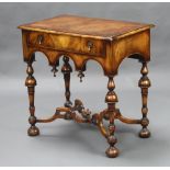 A 1930's Queen Anne style figure walnut side table fitted a frieze drawer, raised on turned supports