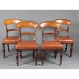 A set of 4 late Victorian mahogany bar back dining chairs with shaped mid rails and over stuffed