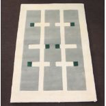 A contemporary Indian wool, white, grey and green ground rug 189cm x 121cm Some light staining in