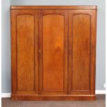 A Victorian mahogany triple wardrobe with moulded cornice, the left hand section fitted 3 trays