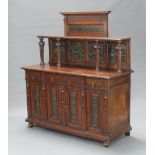 A 19th Century oak and embossed metal dresser, the raised back fitted 4 embossed copper panels