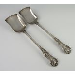 A pair of Victorian silver Kings pattern serving spoons, London 1875, 292 grams