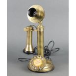 A reproduction brass candlestick telephone marked "The British Ericson London" 33cm x 13cm