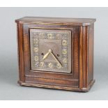 Brevington Ltd, a 1930's Art Deco striking mantel clock with square embossed copper dial with Arabic