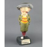 A reproduction resin Penfold advertising golfing figure of a standing golfer with pipe, marked "He