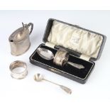 A cased napkin ring and spoon, a mustard spoon, napkin ring and Edwardian mustard 158 grams