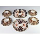 A Royal Crown Derby Imari pattern part tea set comprising 4 tea cups, 4 saucers, 4 small plates, a