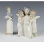 A Lladro group of 3 singing angels 18cm, a ditto of a girl carrying a piglet 16cm