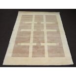 A contemporary white ground Indian wool rug with geometric designs 239cm x 172cm Stained and moth