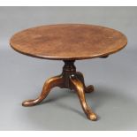 A circular Georgian mahogany tea table raised on a turned column and tripod base (cut down) 48cm h x