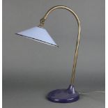 A mid-Century industrial light green and blue enamel anglepoise style lamp, raised on a circular