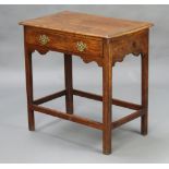 An 18th Century oak side table fitted a drawer, raised on square supports with box stretcher 54cm