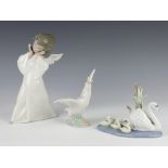 A Lladro figure of an angel 22cm, ditto of a goose 15cm and a group of swans 5722 15cm