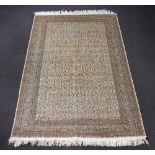 A white and grey ground Turkish carpet with floral pattern within a multi row border 292cm x 194cm