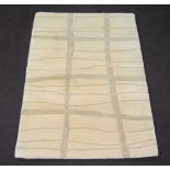 A contemporary Indian white ground rug with geometric designs 180cm x 120cm