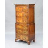 A 1930's Georgian style mahogany chest on chest with moulded cornice, fitted 2 short and 3 long