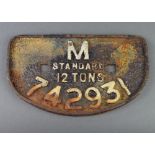 A cast iron railway wagon plate marked M.Standard 12 tons 742931 16cm x 28cm