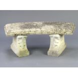 A well weathered crescent shaped concrete garden bench, raised on scrolled supports 44cm h x 113cm w