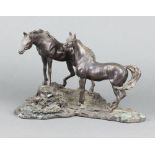 Franklin Mint, after Lanford Monroe, a bronze figure group "Intruders" study of 2 horses on a