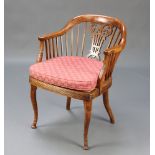 An Edwardian Thonet beech framed tub back chair with woven cane seat, raised on cabriole supports