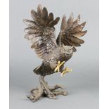 A bronze figure of an owl in flight 30cm x 24m x 12cm, the base indistinctly signed and marked 91IEM