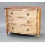 A William IV bleached mahogany bow front chest of 3 drawers with brass ring drop handles and