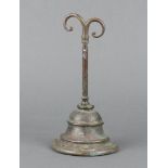 A Victorian brass bell shaped door stop, the back marked W T and S, 25cm x 12cm x 6cm