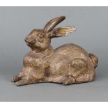 A bronze figure of a seated rabbit 16cm x 22cm x 12cm
