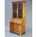 An Edwardian bleached mahogany Chippendale style bureau bookcase with moulded and dentil cornice,