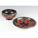 A William Moorcroft shallow dish decorated with pomegranates with signature and impressed mark 22.