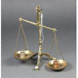 Doyle & Sons, a pair of gilt metal bank scales together with 3 weights 54cm x 35cm