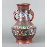 A 19th Century Japanese bronze and enamelled twin handled urn 30cm h x 19cm diam.