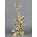 A 19th Century polished brass door stop in the form of a standing cherub raised on a crescent shaped