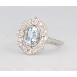A white metal stamped plat. aquamarine and diamond ring, the centre stone 0.9ct, the brilliant cut