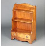 A Georgian style arch shaped 3 tier mahogany waterfall bookcase, the base fitted a drawer, raised on
