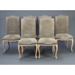 A set of 6 French style high back dining chairs upholstered in mushroom coloured material, raised on