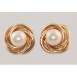 A pair of 9ct yellow gold cultured pearl whorl ear studs, 3.5 grams