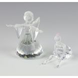 A Swarovski Crystal figure of an angel by Adi Stocker 7475000600 8cm (1 wing detached) and a young