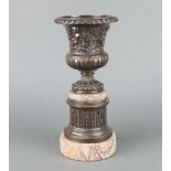 A Georgian style cast bronze urn raised on a polished marble base 33cm h x 14cm diam.