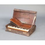 Metzler & Co. 37 Marlborough Street, London, a folding 'missionary' organ, contained in an oak bible