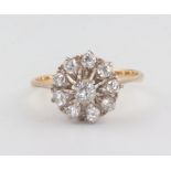 A yellow metal 10 stone diamond cluster ring 2.5 grams, size Q