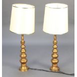 A pair of gilt metal table lamps 62cm x 13cm