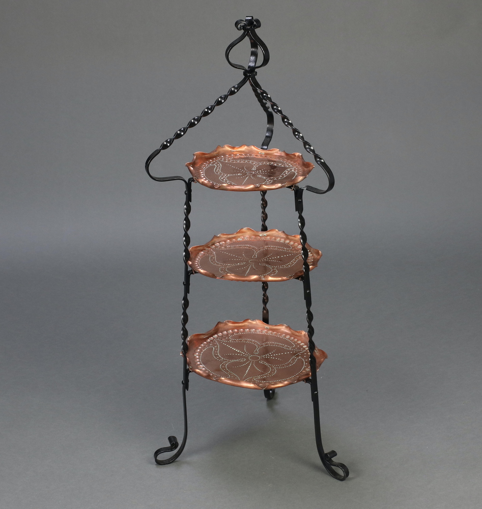 A Victorian Art Nouveau embossed copper and wrought iron circular 2 tier graduated cake stand 90cm h