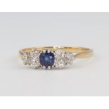 A yellow metal 18ct sapphire and diamond ring, size P 1/2, 2.3 grams