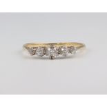 A yellow metal 5 stone diamond ring 1.8 grams, size Q 1/2