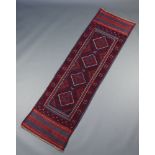 A red and blue ground Meshwani runner with 4 diamonds to the centre 243cm x 67cm