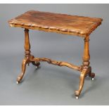 A Victorian rectangular shaped rosewood stretcher table, raised on turned supports with H framed