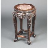 A Chinese 19th Century pierced carved hardwood and pink veined marble jardiniere stand, raised on