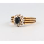 An 18ct yellow gold sapphire and diamond cluster ring, size O, 5 grams